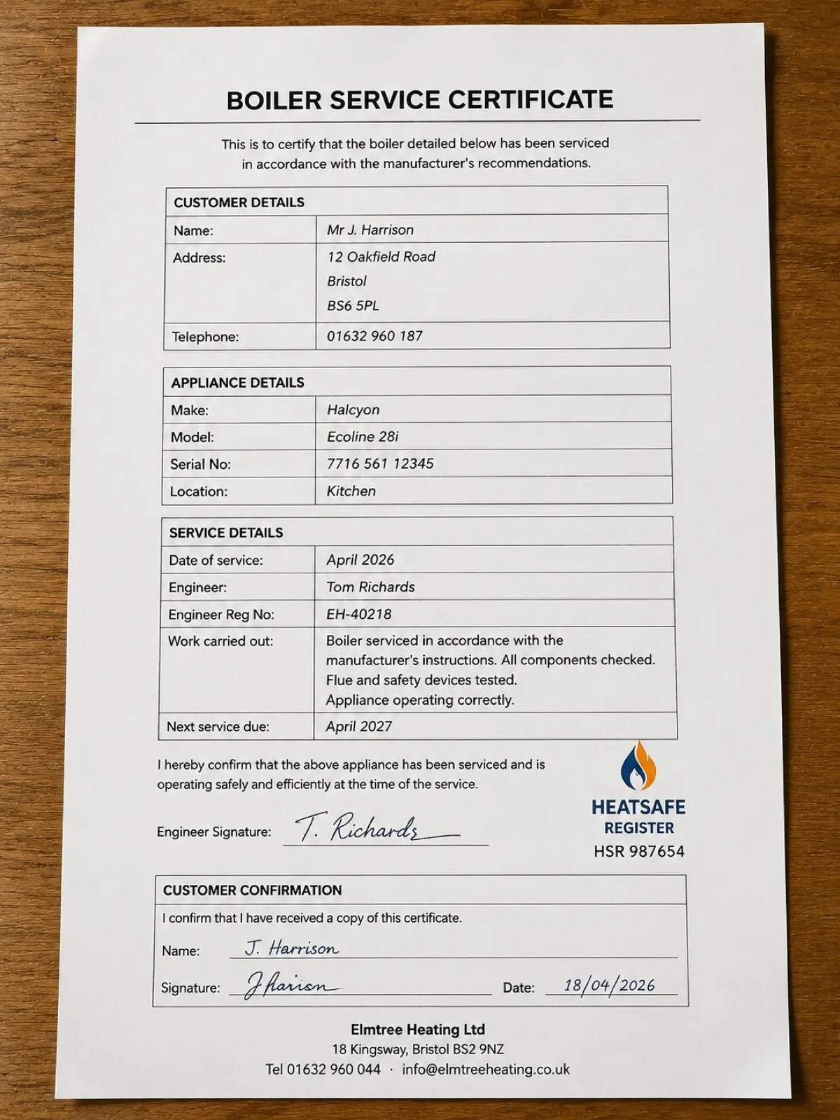 A boiler service certificate lying on a worktop