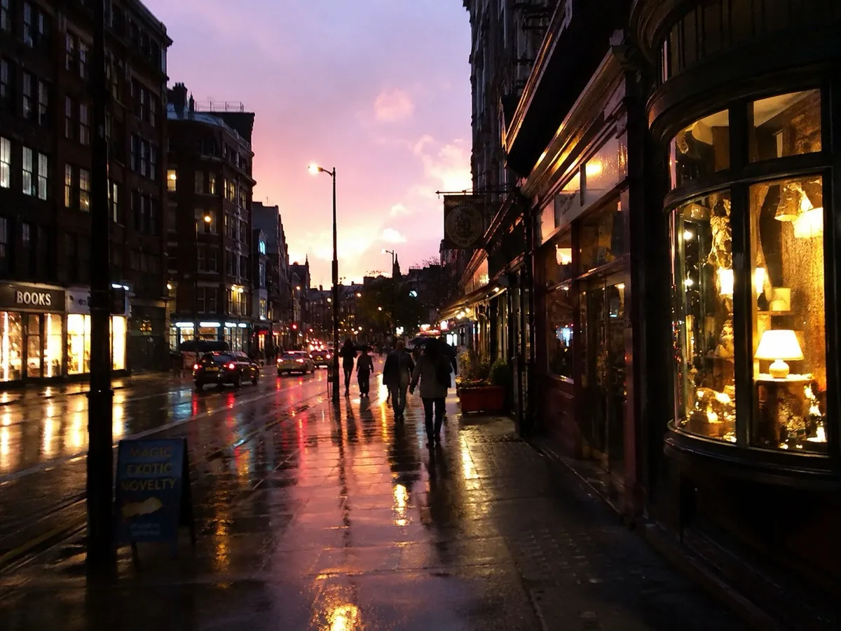A city street at dusk after rain